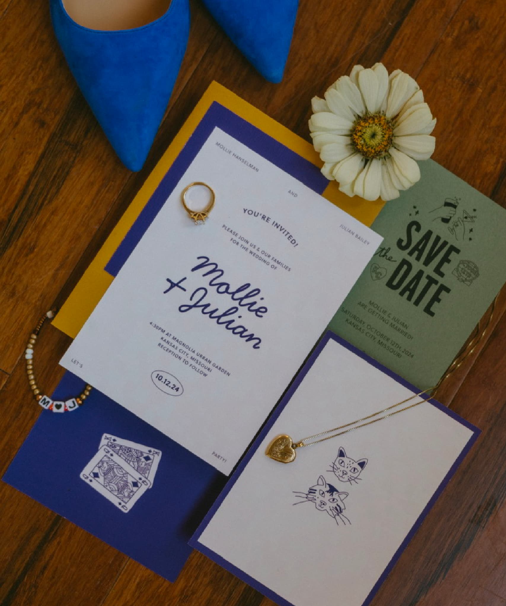 A wedding invitation suite with a flat lay of shoes, florals and jewlery