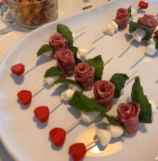 Caprese skewers with wooden red heart on the end
